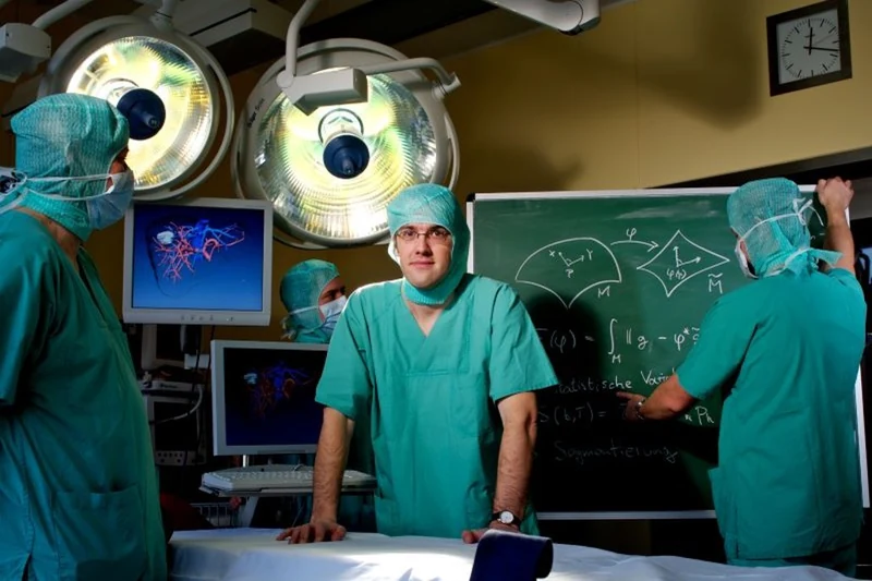 Research meets medical practice: a surgical setting and a scientific blackboard.